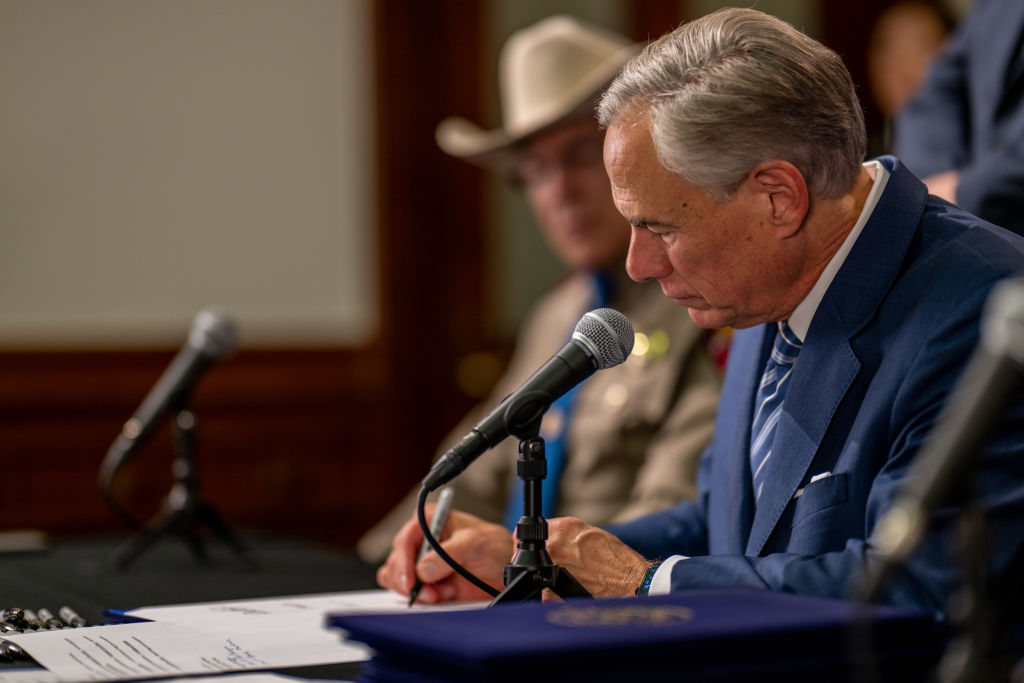 Texas Governor Abbott signs bill in Texas State Capitol