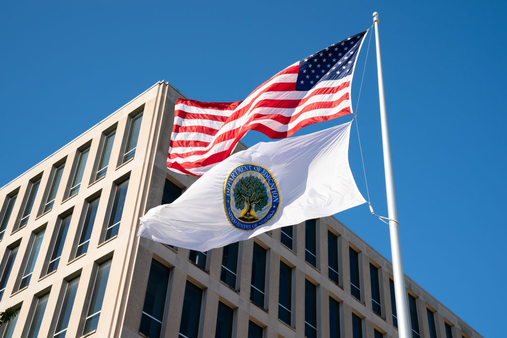 Flags for the U.S. and the U.S. Department of Education fly outside the Department of Education building in Washington, D.C.