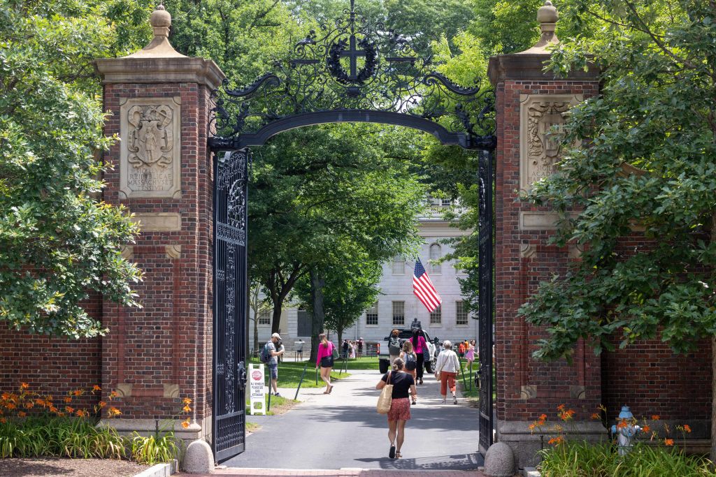 Students walking through the gate in Harvard Yard