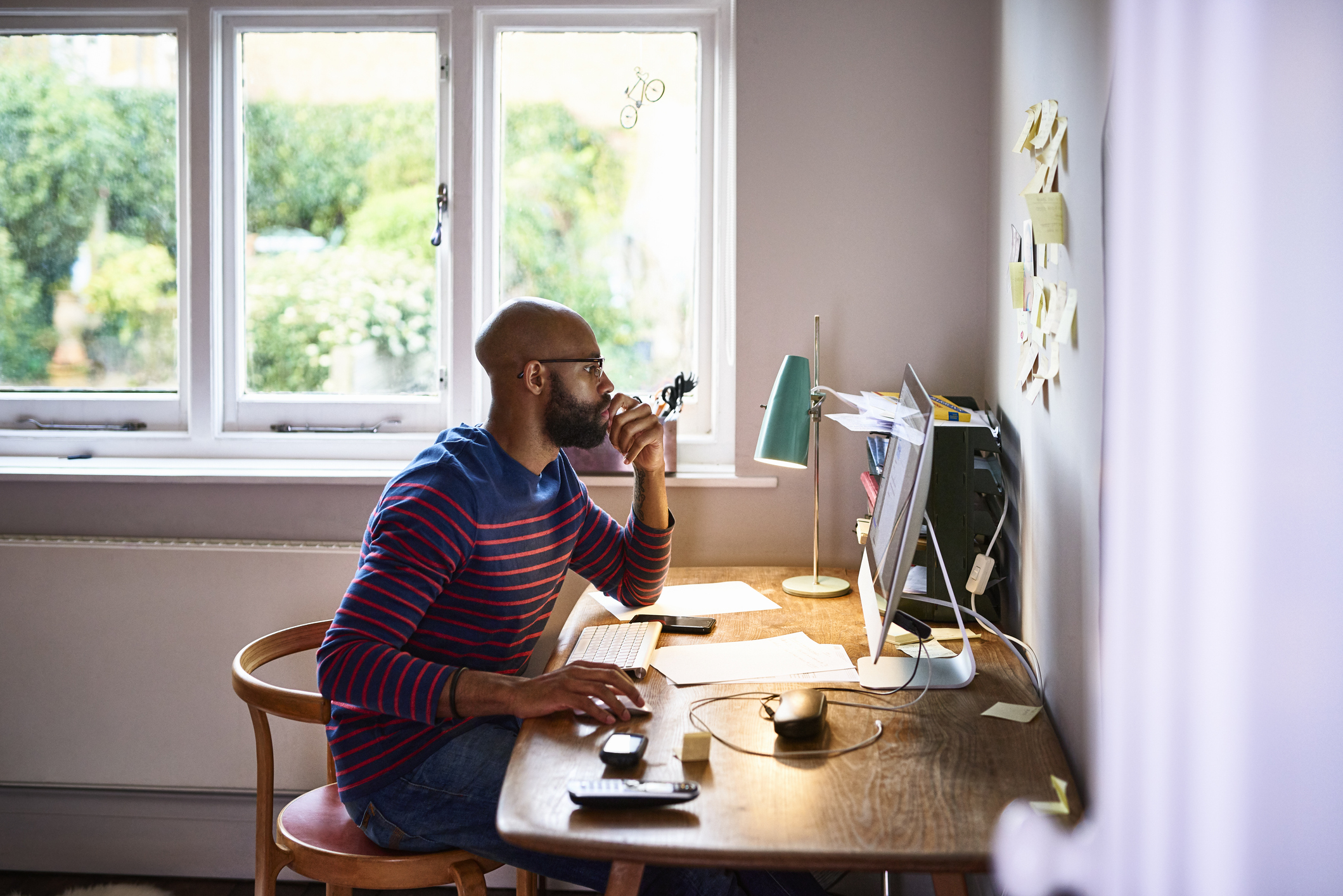 Online student working at his desk at home