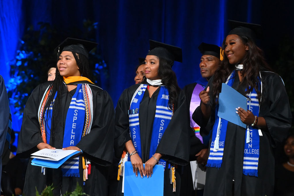 Spelman College graduates onstage during the college's 2023 commencement ceremony at Georgia International Convention Center on May 21, 2023.