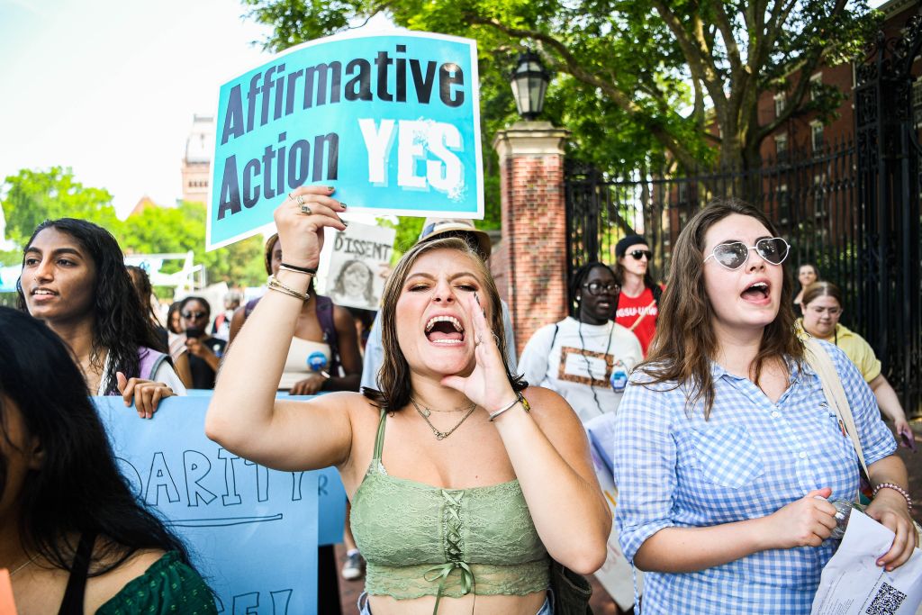 Participants march and chant slogans at a rally protesting the Supreme Court's ruling against affirmative action on Harvard University Campus in Cambridge, Massachusetts, on July 1, 2023. The U.S. Supreme Court ruled that race-conscious admissions policies used by colleges and universities are unconstitutional, in a pair of cases involving Harvard University and the University of North Carolina at Chapel Hill. The Supreme Court stated that the admissions policies of Harvard and the University of North Carolina UNC, two of the oldest institutions of higher learning in the country, violated the equal protection clause of the 14th Amendment to the United States Constitution.