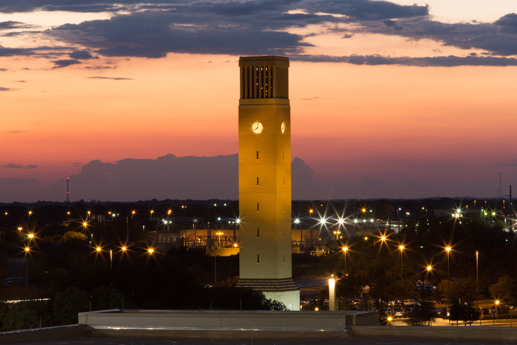 Albritton Bell Tower at the Texas A&M University campus at night.