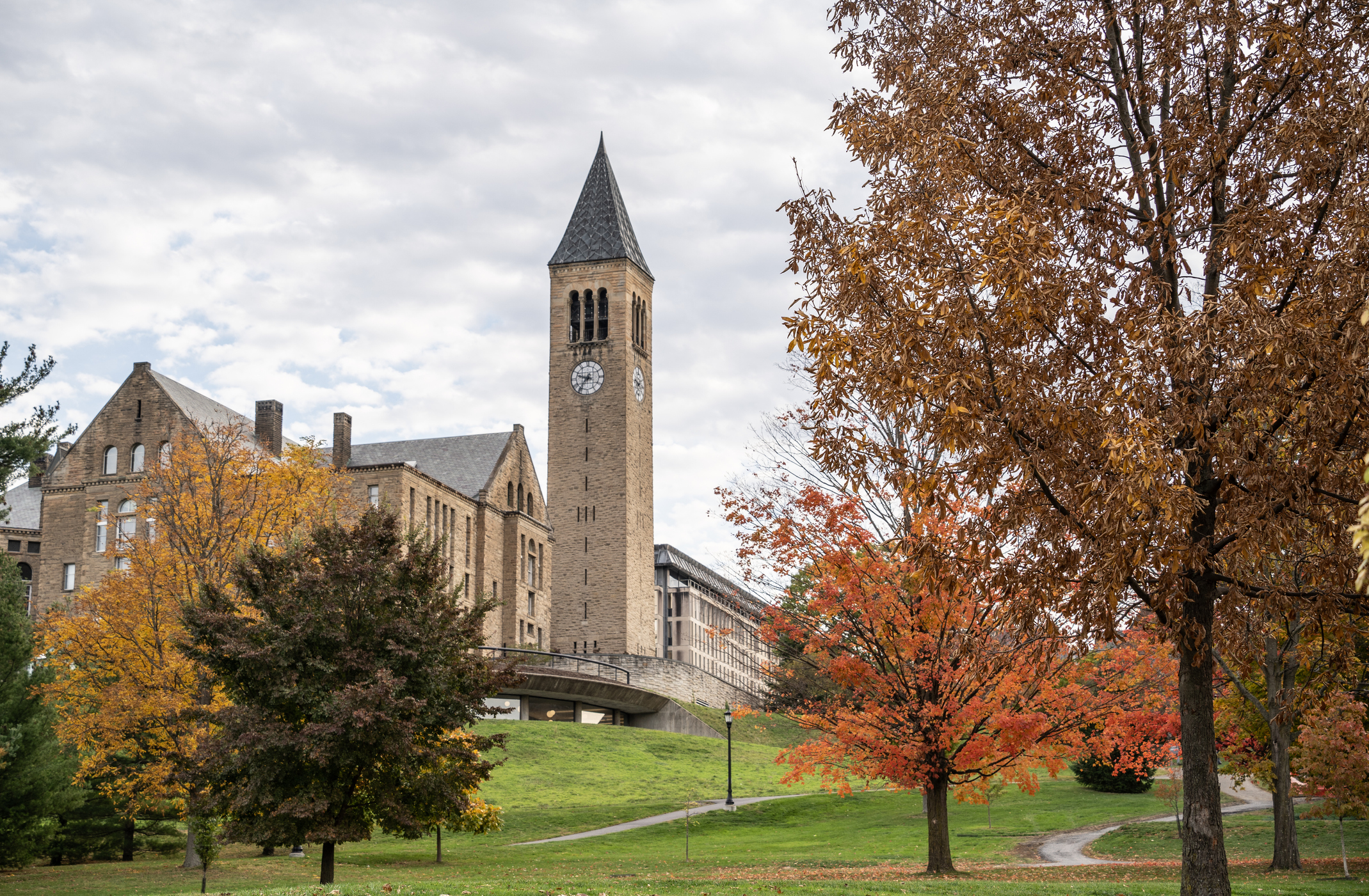 McGraw Clock Tower on the Cornell University campus on a sunny fall day. Cornell University is a top ranked ivy league and land-grant university located in the city of Ithaca in finger lakes region of New York.