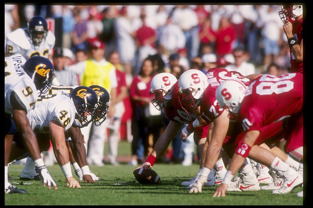 Cal vs Stanford football players before a play begins