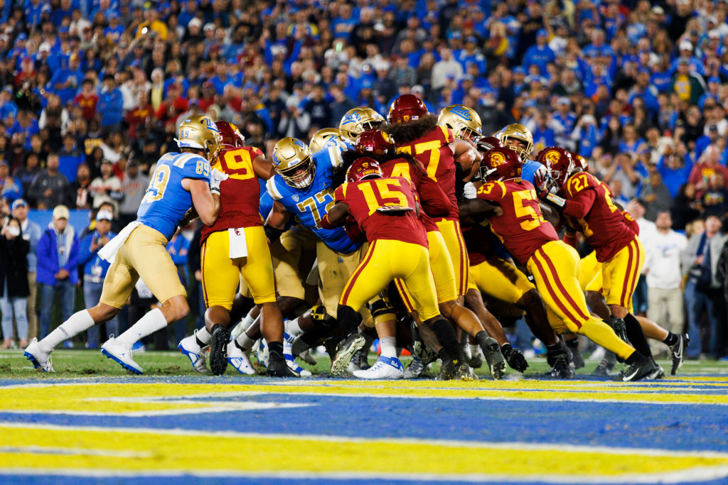 USC Trojans defensive unit group tackle during the NCAA college football game between the USC Trojans and the UCLA Bruins on November 19, 2022 at the Rose Bowl Stadium in Pasadena, California.