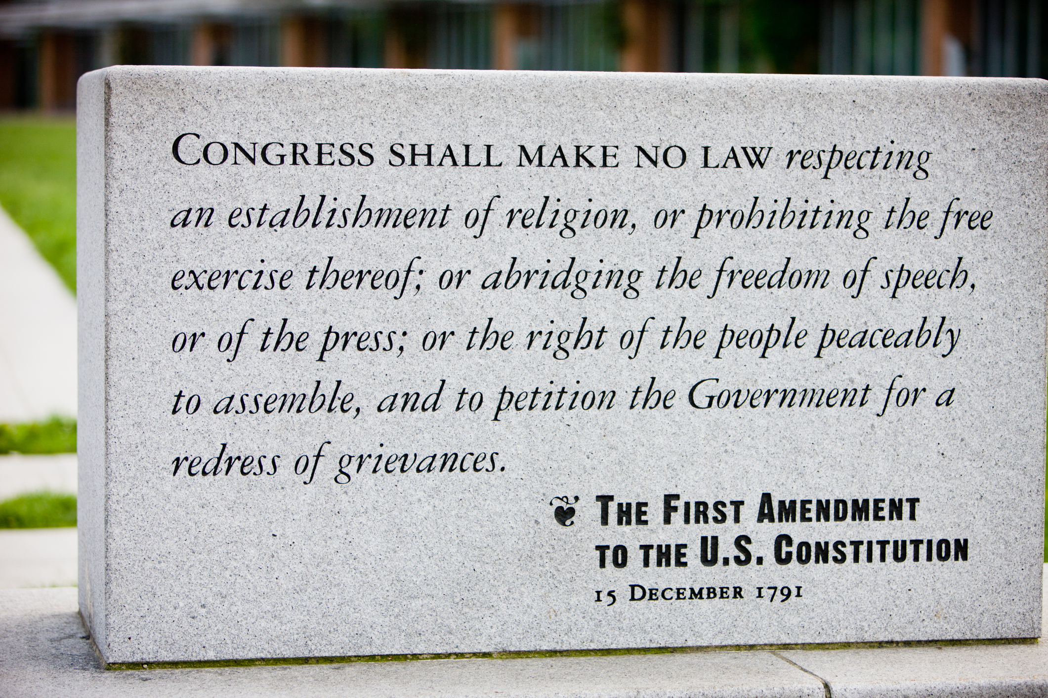 The first amendment of the US Constitution engraved on a stone