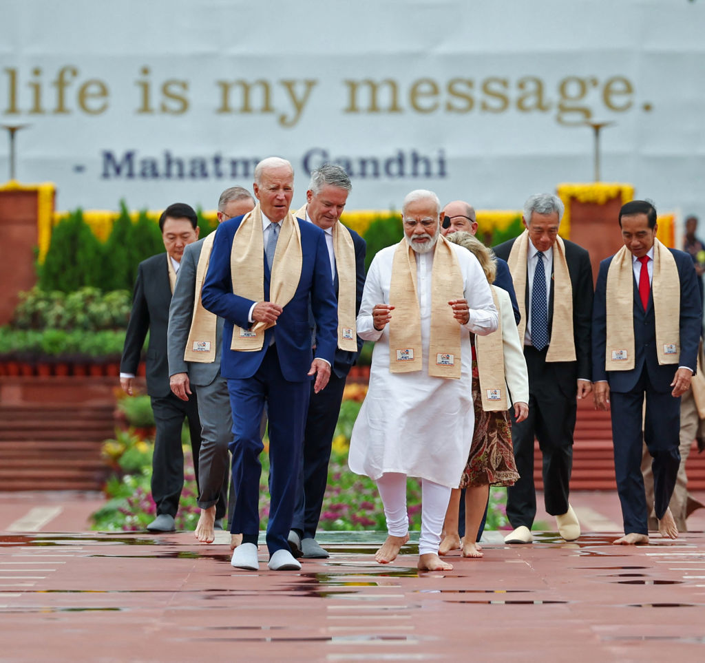 India's Prime Minister Narendra Modi (C), US President Joe Biden (L) along with world leaders arrive to pay their respect at the Mahatma Gandhi memorial