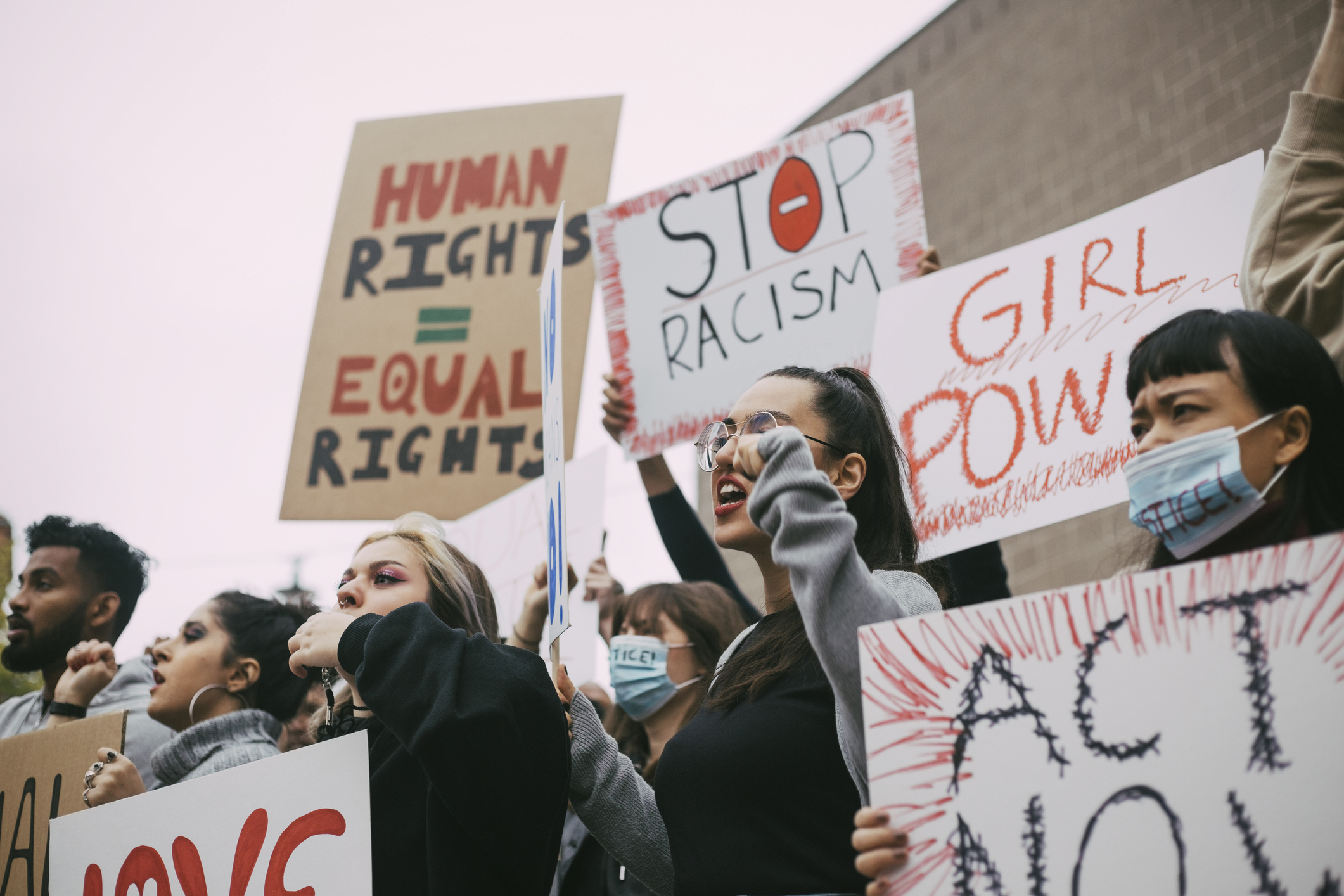 Male and female activists protesting for human rights in social movement