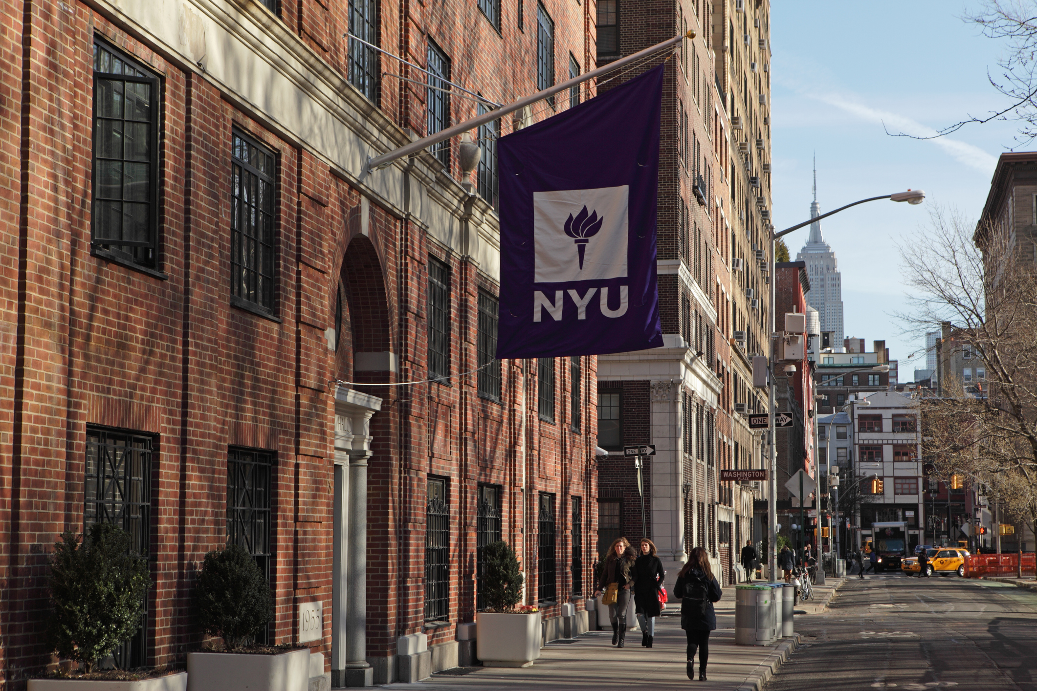 NYU flag on campus building