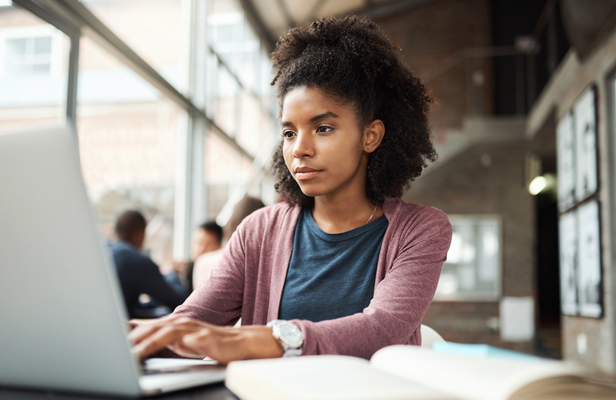 Student education, laptop and black woman typing research assignment for university, college or school study project. Learning, scholarship and African girl writing story for USA Black History Month